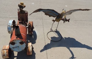 lot 3 image: METAL YARD ART  Toucan 54x37 and Vintage tractor  32x38