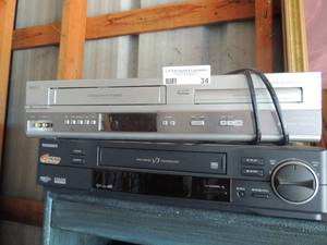 lot 34 image: Toshiba and Philips, 1 gray with DVD & VHS combo player black Toshiba DVR player