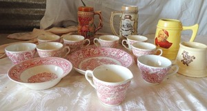 lot 47 image: red and white dishes from England- 8 cups, 1 creamer, 1 soup bowl, 1 salad plate  CARDINAL Stein, Lion and BREWING Co. stein, WONDER WALL STEIN