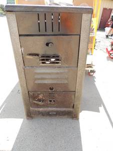 lot 58 image: Oakland metal wood burner 016-8s works great