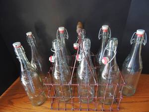 lot 92 image: 8 Geyer Feres Munster Mile -  snap top glass bottles 6 are in a metal holder 1895