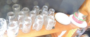 lot 82 image: 3 Corel dinner plates 6 Correll saucers,2 tins,10 bubble glass jars  and other glasses