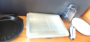 lot 89 image: Stainless steel 13x9 x 2 covered pan,  can opener,  cheese grater,  3 WEDGEWOOD Hedge Rose England plates,  2 metal cake pans