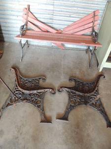 lot 21 image: Porch bench in need of repair with 2 EXTRA  bench ends to build another.