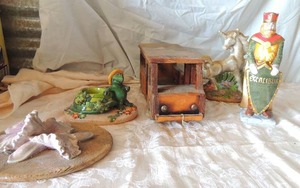 lot 45 image: Wooden shell decor art 10x5, Porcelain turtle, wooden bus , unicorn statue 10high   Excalibur Vegas