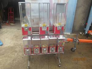 lot 71 image: 8 HEAD GUMBALL DISPENSER ON CART WITH CASTERS LOCKS HAVE BEEN REMOVED MACHINE IS OPEN