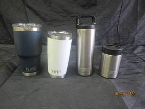 lot 83 image: 3 YETI CUPS WITH LIDS AND 1 YETI CAN HOLDER