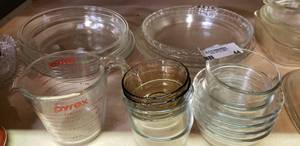 lot 44 image: Pyrex Lot Pie Plates, Measuring Cup, and Small Dishes