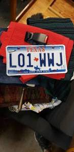 lot 158 image: Misc. Odds and Ends includes clothes, pillows, license plate, fireplace sweep