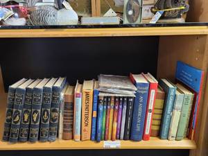 lot 662 image: LOT OF ASSORTED BOOKS INCLUDING THE BOOK OF LIFE, READERS DIGEST CONDENSED BOOKS, THE 39 CLUES, RONALD REAGAN AN AMERICAN LIFE, AND MORE AS SHOWN.