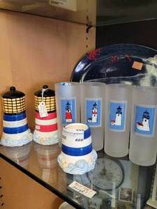 lot 666 image: CERAMIC LIGHTHOUSE THEMED CANDLE HOLDERS WITH CANDLES AS SHOWN.