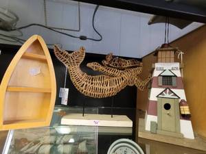lot 676 image: WOOD LIGHTHOUSE DISPLAY, WOOD BOAT SHAPED SHELF, PLUS WICKER STYLE MERMAID FIGURE ON STAND AS SHOWN.