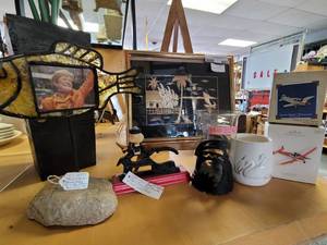 lot 697 image: HALLMARK ORNAMENTS, CANDLE HOLDERS, VINTAGE CAST IRON NUT CRACKER, PHOTO FRAME AS SHOWN.