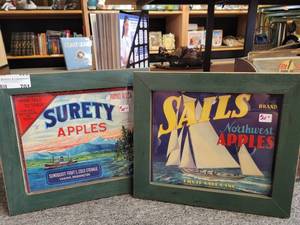 lot 701 image: VINTAGE FRAMED SAILS-NORTHWEST APPLES AND SURETY APPLES ADVERTISING SIGNS AS SHOWN.