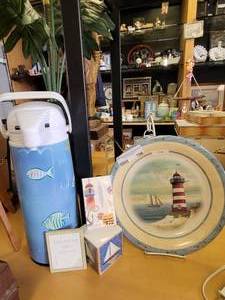 lot 706 image: LIGHTHOUSE THEME PLATE WITH HOLDER, HOT BEVERAGE CARAFFE AND MORE AS SHOWN.