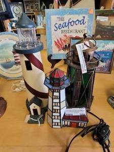 lot 708 image: METAL LIGHT UP LANTERN WITH TIMER, LIGHTHOUSES IN STYLESCOLORS SHOWN.