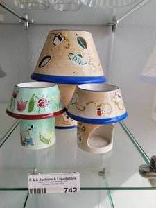 lot 742 image: LOT OF 3 CERAMIC LAMP SHAPED CANDLE HOLDERS IN STYLESDESIGNS SHOWN.