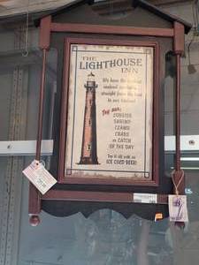 lot 748 image: THE LIGHTHOUSE INN PUB SIGN AS SHOWN. 19 X 26.