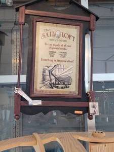 lot 749 image: THE SAIL LOFT PUB STYLE SIGN ON WOOD FRAME AS SHOWN.