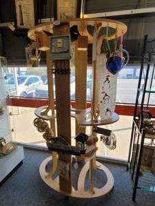 lot 754 image: WOODEN DISPLAY WITH ROLLERS IN STYLECOLOR CONDITION SHOWN.