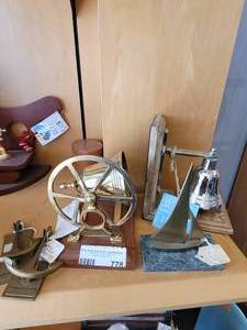 lot 778 image: BRASS SAILBOAT ON MARBLE BASE 5, BRASS ANCHOR KNOCKERS, BRASS MIDSHIPMANS BELL, SILVERTONE BELL ON WOOD BASE.