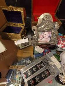 lot 800 image: SKULL CANDLE HOLDERS, GLASS TREASURE CHEST BANK, WOOD JEWELRY BOXES, PHOTO FRAME, AND MORE AS SHOWN.