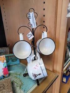 lot 803 image: SET OF 4 LIGHTHOUSE THEM COFFEE CUPS WITH METAL HOLDER AS SHOWN.