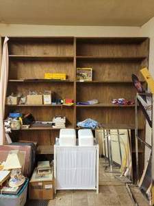 lot 985 image: WOODEN SHELVING UNIT WITH ASSORTED CONTENTS INCLUDING TOYS, GAMES, BOOKS AS SHOWN. ONLY CONTENTS ON SHELVES ARE INCLUDED  (DELAYED PICK UP BETWEEN 200 PM AND 400 PM)