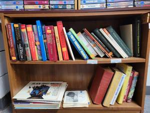 lot 1009 image: CONTENTS OF BOOKCASE INCLUDING ASSORTED BOOKS AND VINYL RECORDS AS SHOWN. BOOKCASE NOT INCLUDED