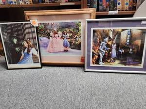 lot 1010 image: LOT OF 3 FRAMED WIZARD OF OZ THEMED PICTURES AS SHOWN.