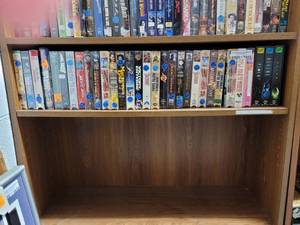 lot 1015 image: LOT OF ASSORTED VHS MOVIES ON FIFTH SHELF ONLY AS SHOWN.