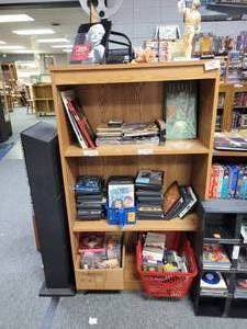 lot 1055 image: 4-TIER BOOKCASE  SHELF IN STYLECOLORCONDITION SHOWN. CONTENTS SHOWN NOT INCLUDED  (DELAYED PICK UP BETWEEN 200 PM AND 400 PM)