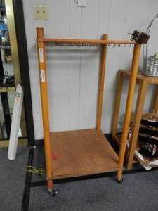 lot 901 image: WOODEN DISPLAY UNIT WITH ROLLERS IN STYLE SHOWN.