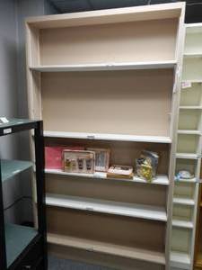 lot 918 image: WOODEN DOUBLE-SIDED UNIT WITH SHELVES IN STYLECOLOR SHOWN. CONTENTS SHOWN NOT INCLUDED