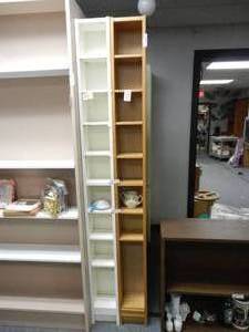 lot 919 image: LOT OF 2 TALL AND SLIM DISPLAY SHELF UNITS IN STYLESCOLORS SHOWN. CONTENTS SHOWN NOT INCLUDED