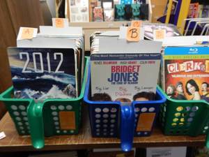 lot 1076 image: ASSORTED RENTAL MOVIE CARDS IN 3 BASKETS AS SHOWN. GENEROUS COUNT