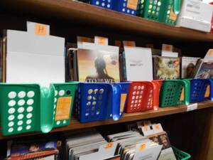 lot 1077 image: ASSORTED RENTAL MOVIE CARDS IN 5 BASKETS AS SHOWN. GENEROUS COUNT