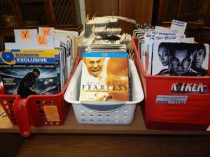 lot 1112 image: ASSORTED RENTAL MOVIE CARDS IN 3 BASKETS AS SHOWN. GENEROUS COUNT