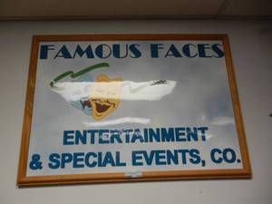 lot 1123 image: FAMOUS FACES FRAMED SIGN AS SHOWN.