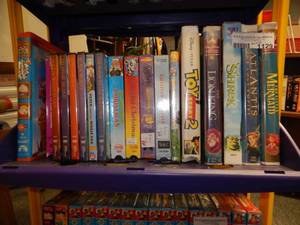 lot 1129 image: LOT OF ASSORTED DISNEY VHS MOVIES AND OTHER DVDS AS SHOWN.