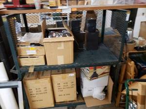 lot 1041 image: METAL WAREHOUSE CART WITH MESH SIDES ON WHEELS. CONTENTS SHOWN NOT INCLUDED (DELAYED PICK UP BETWEEN 200 PM AND 400 PM)