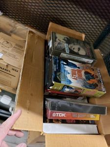 lot 1081 image: LOT OF ASSORTED VHS MOVIES WITH METAL SHELF AS SHOWN.