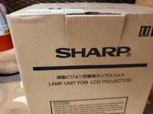 lot 1086 image: SHARP PROJECTOR REPLACEMENT LAMP IN BOX.