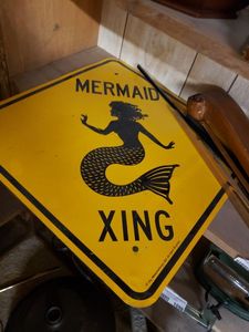 lot 1096 image: MERMAID CROSSING SIGN AND MORE AS SHOWN.