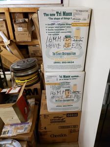 lot 1149 image: LOT OF MOVIE REELS IN ASSORTED SIZESSTYLES.