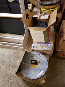 lot 1150 image: LOT OF MOVIE REELS AND CASES IN ASSORTED SIZESSTYLES.
