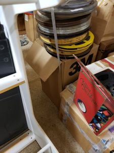 lot 1152 image: LOT OF MOVIE REELS IN ASSORTED SIZESSTYLES.