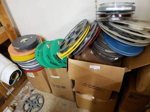 lot 1156 image: LOT OF MOVIE REELS AND CASES IN ASSORTED SIZESSTYLES AS SHOWN. GENEROUS COUNT