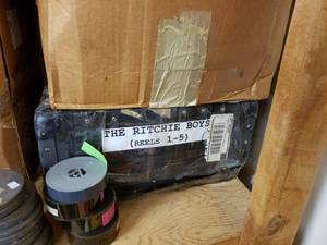 lot 1159 image: VINTAGE MOVIE REELS AND BOXES INCLUDING THE RITCHIE BOYS REELS 1-5 AS SHOWN.