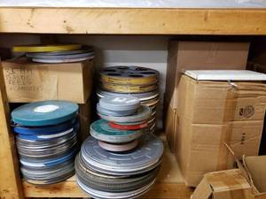 lot 1162 image: LOT OF MOVIE REELS AND CANISTERS IN ASSORTED SIZESSTYLES AS SHOWN.